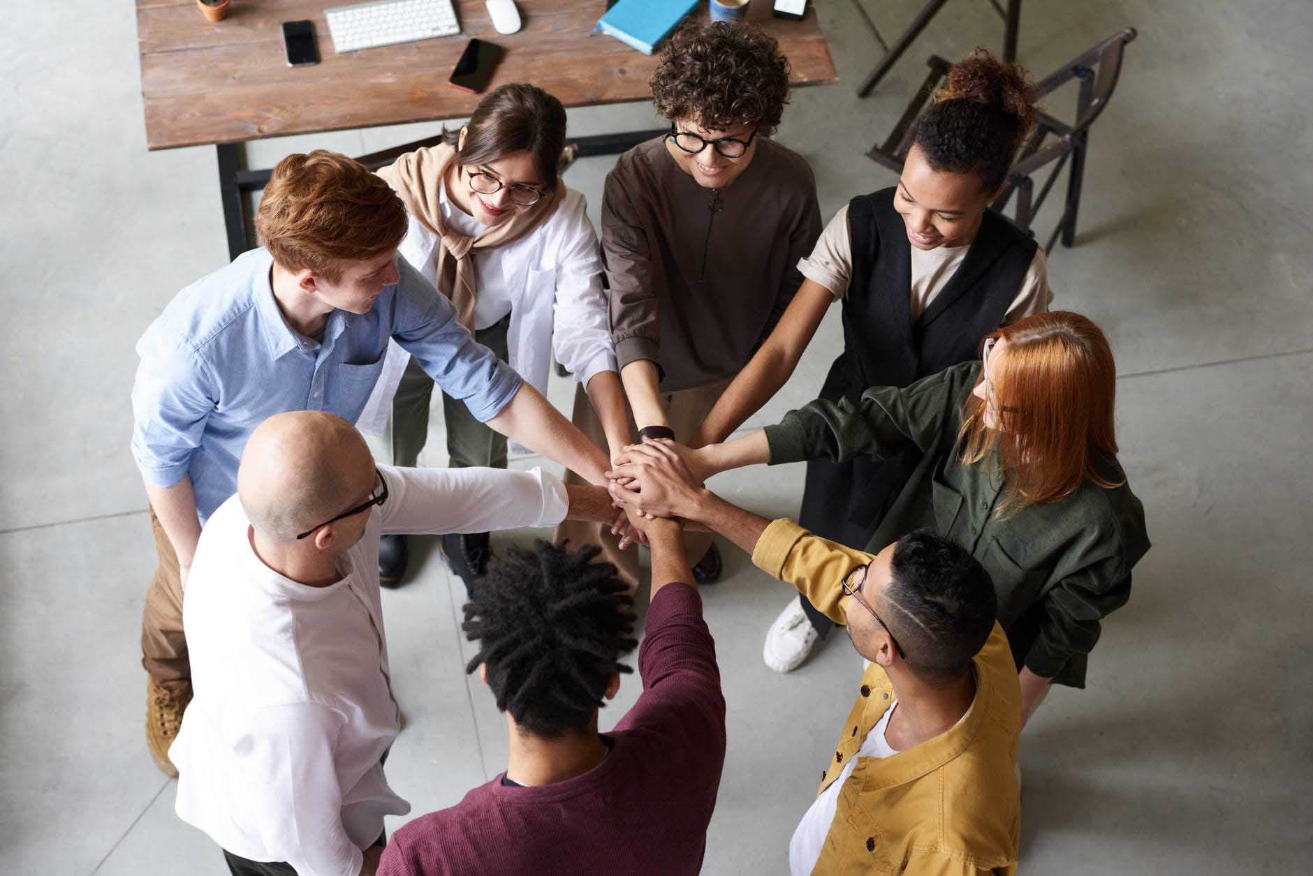 Team putting hands together